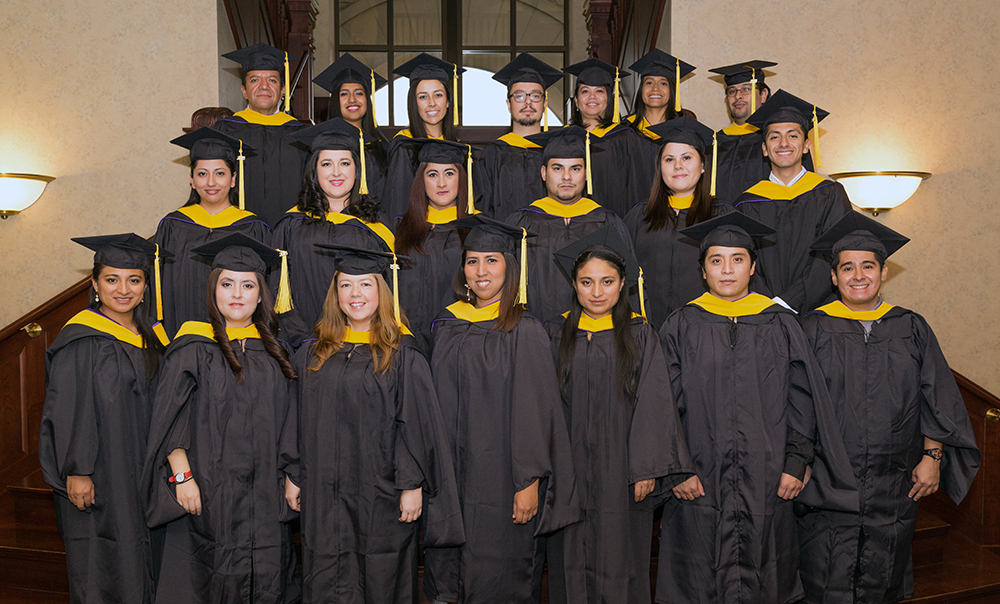 group photo of graduating Ecuadorian master's degree students in theor caps and gowns