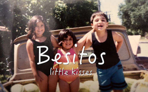 three children in swimming suits looking at the camera, superimposed words Besitos Small Kisses